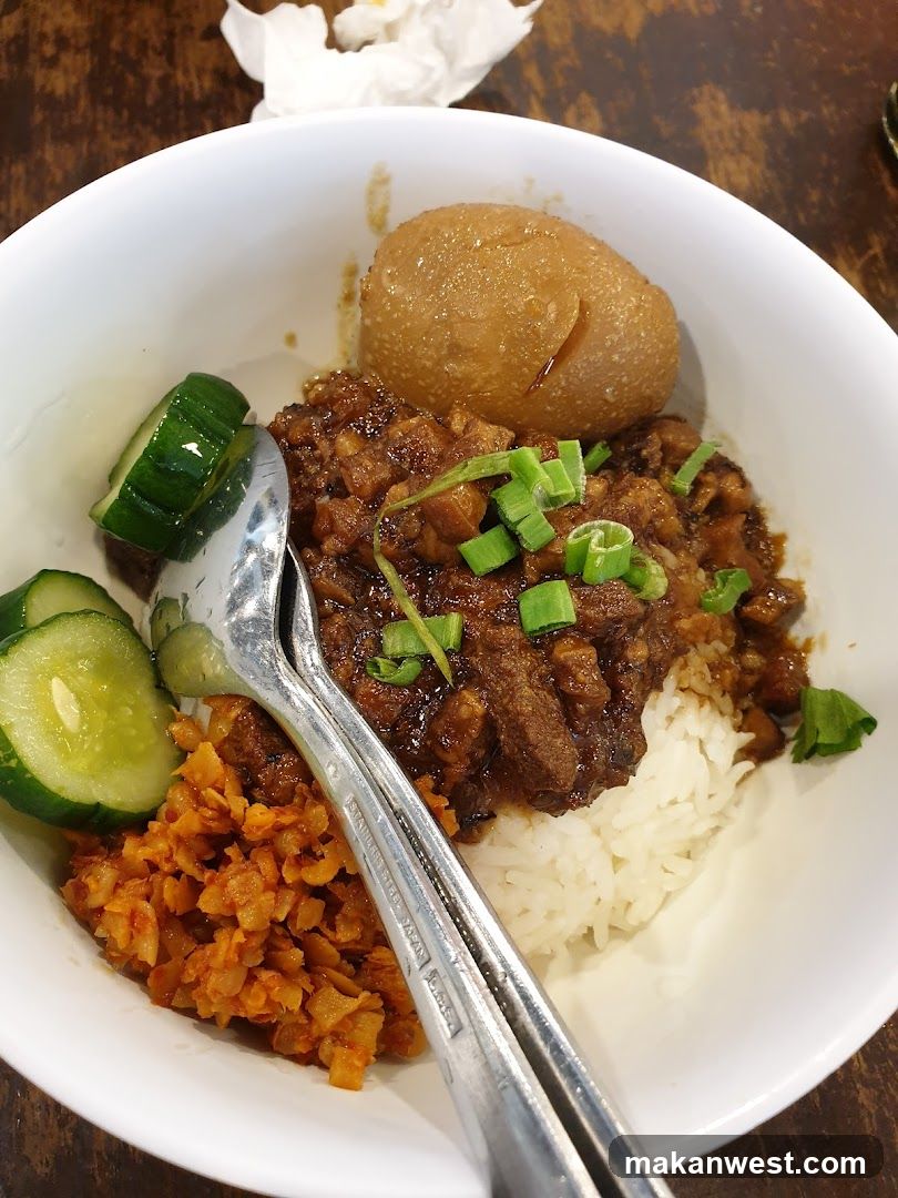 Bowl of Meat Rice with Pickles and Egg