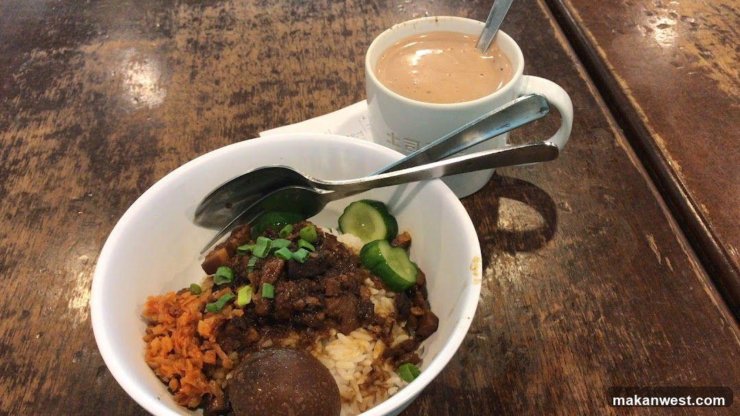 Bowl of Rice with Sauce and Cucumber