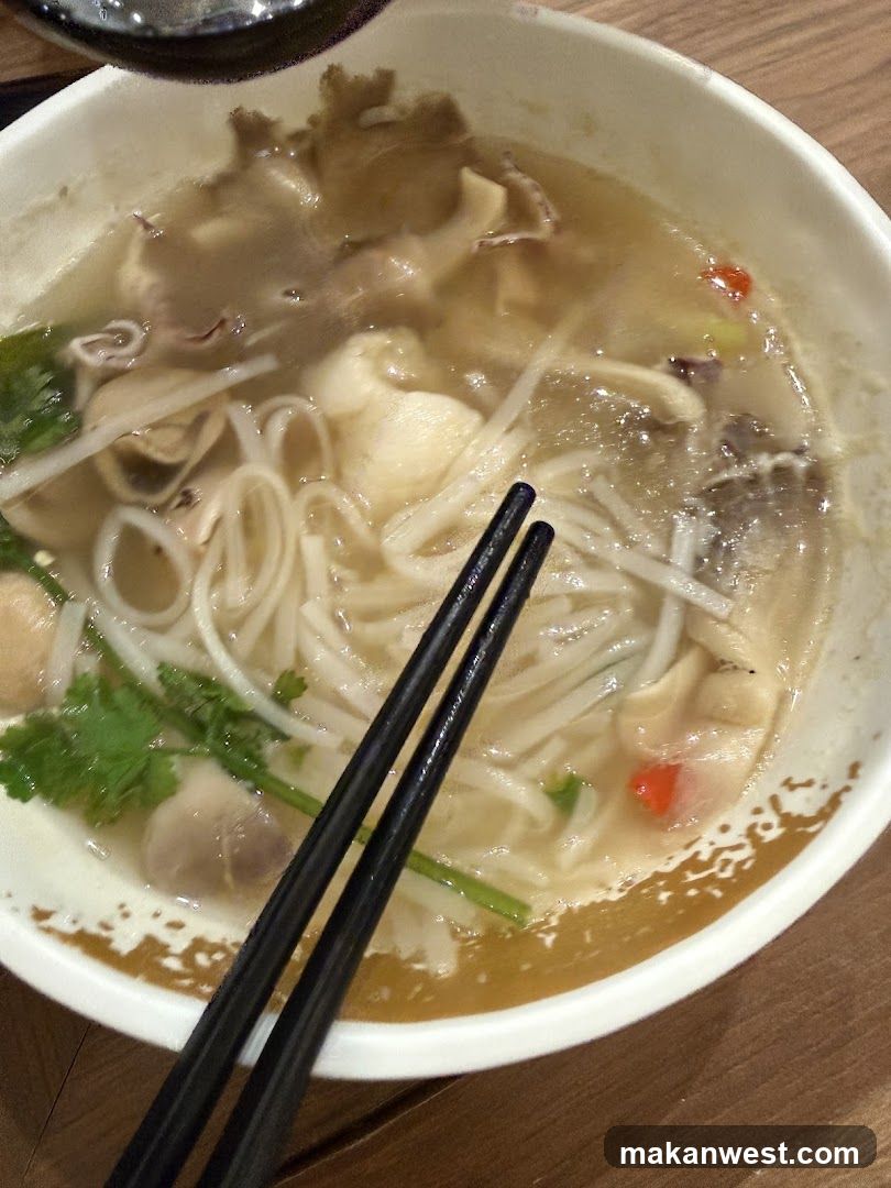 Bowl of Noodle Soup with Chopsticks