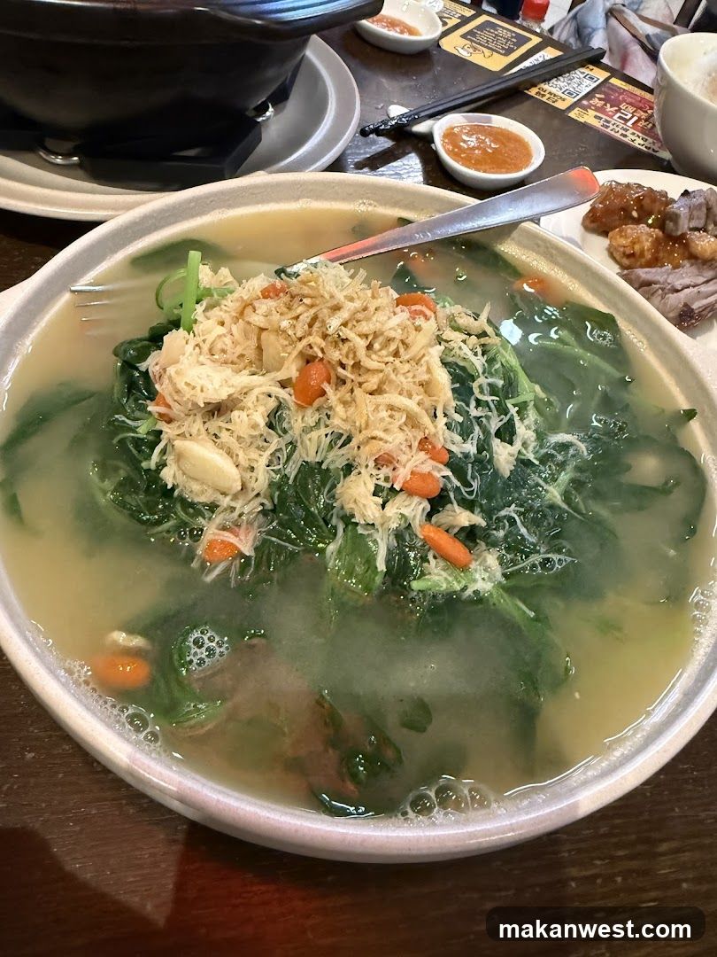 Soup with shredded chicken and greens