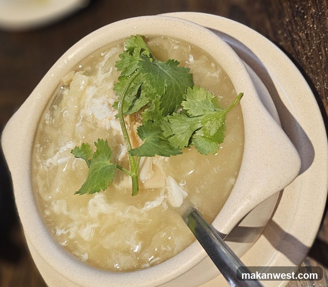 Cup of soup with cilantro garnish