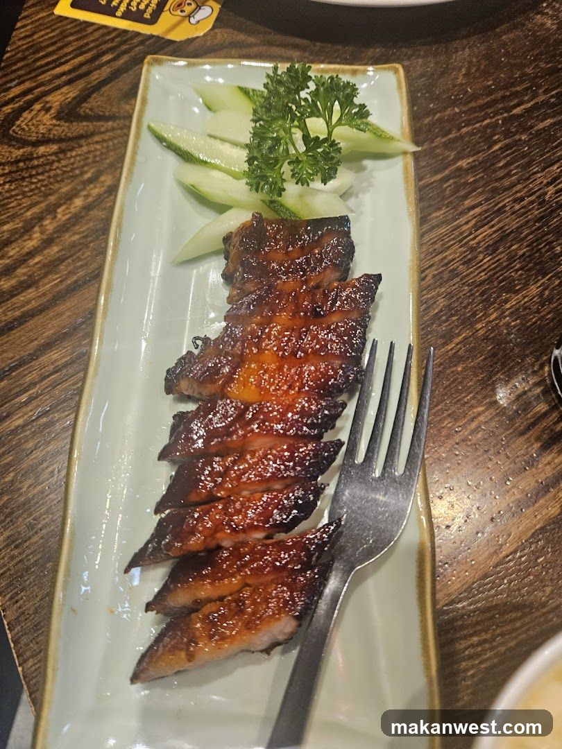 Sliced Roasted Meat with Cucumber Garnish