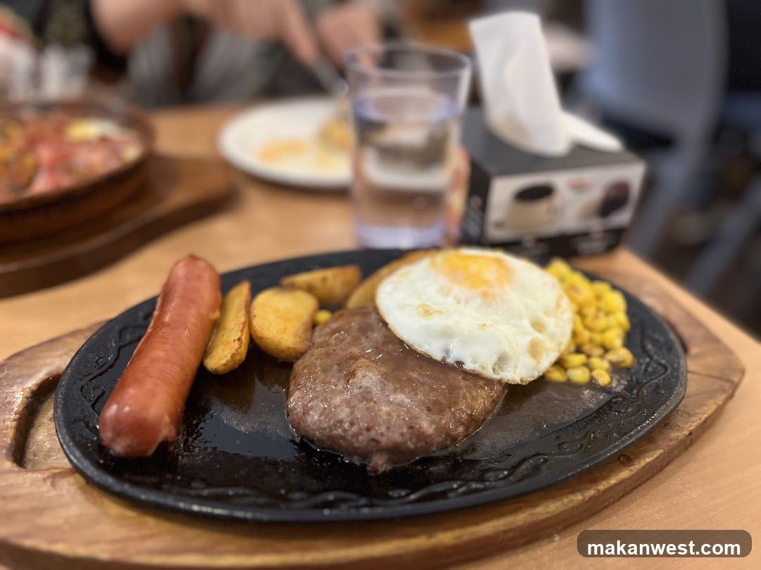 Sizzling Steak Plate with Sausage and Corn