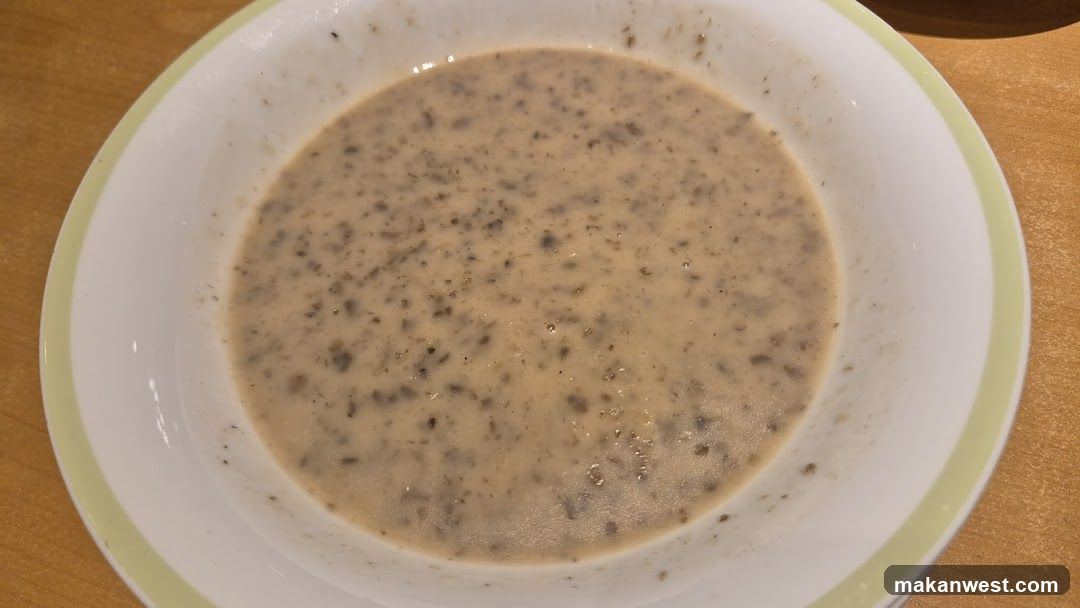 Bowl of creamy soup with herbs