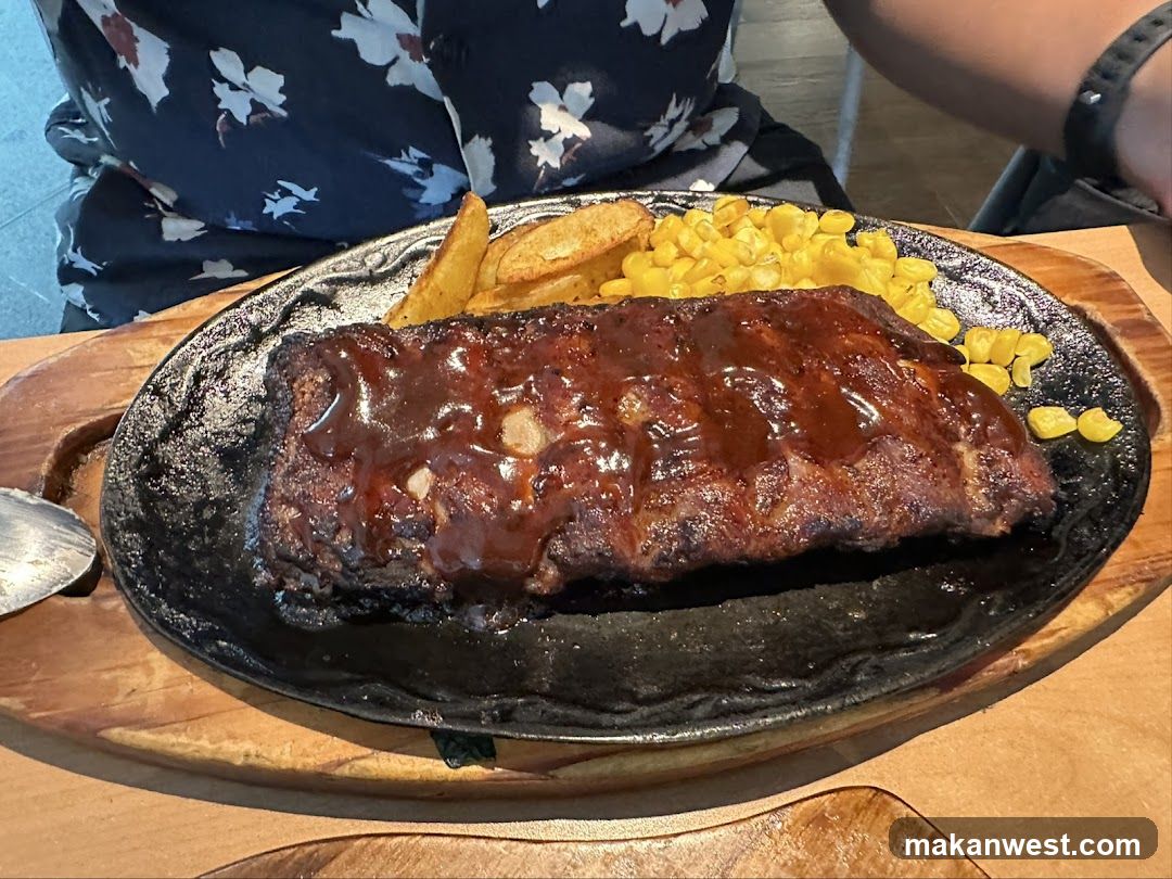 Served Ribs with Corn and Fries