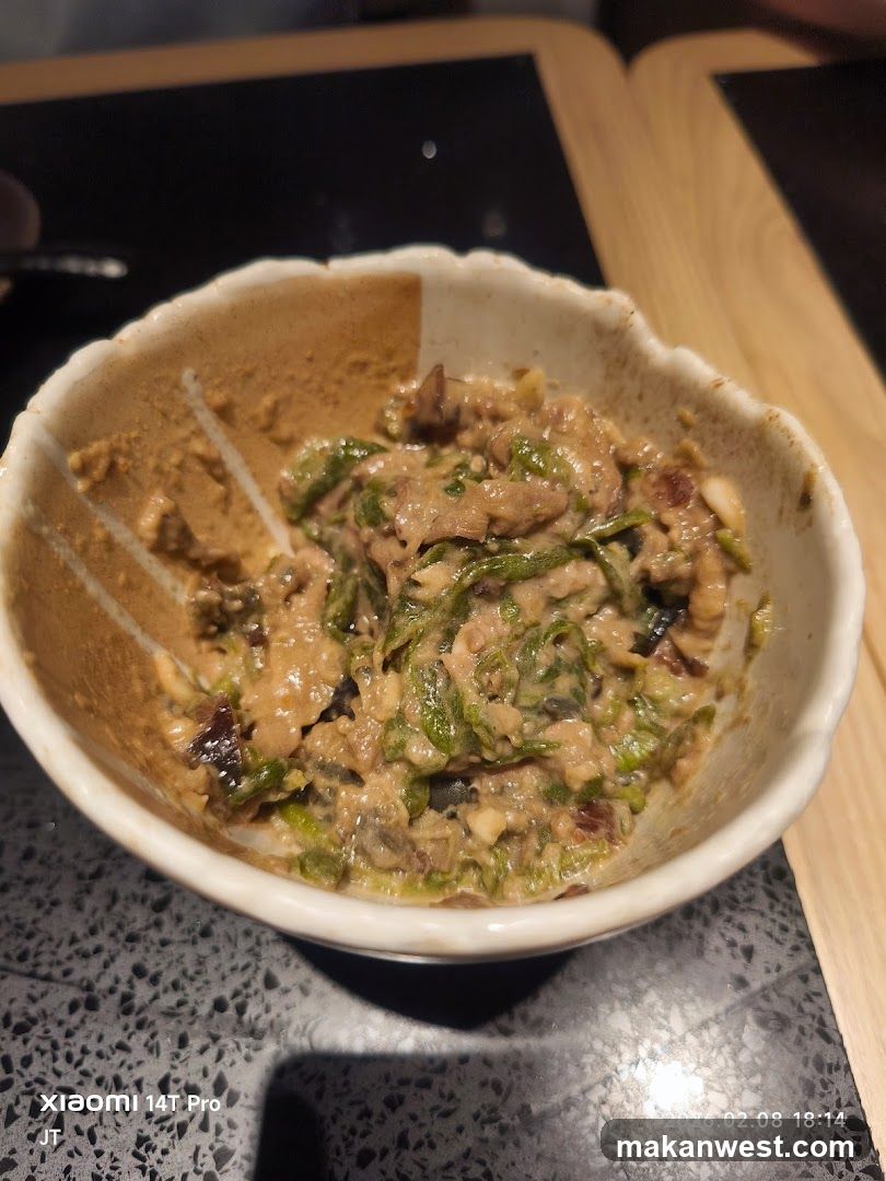Bowl of mixed food with sauce