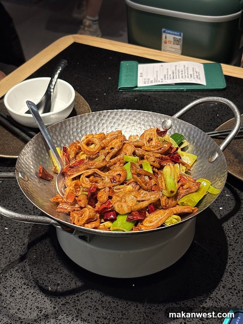 Stir-fried dish in a metal pan