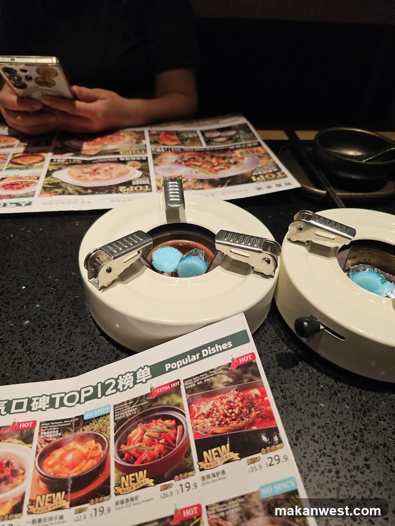 Restaurant Table Setting with Menu and Hot Pot Burners