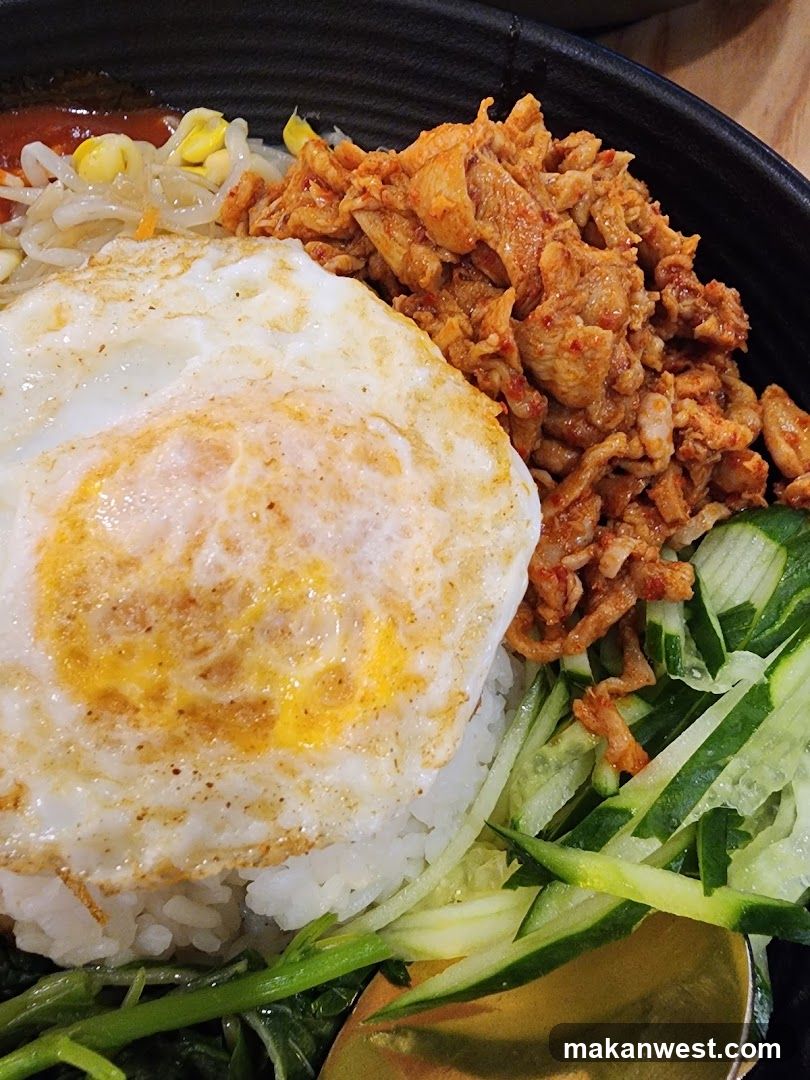 Fried Egg Rice Bowl with Pickled Cucumber and Meat