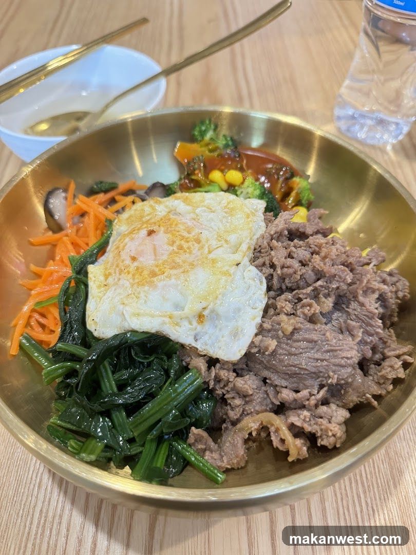 Bowl of Korean-style Bibimbap with Fried Egg and Beef