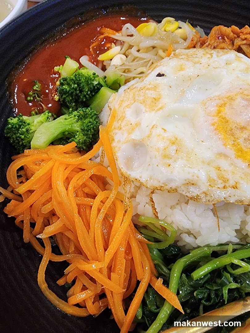 Bowl of Rice with Fried Egg and Vegetables
