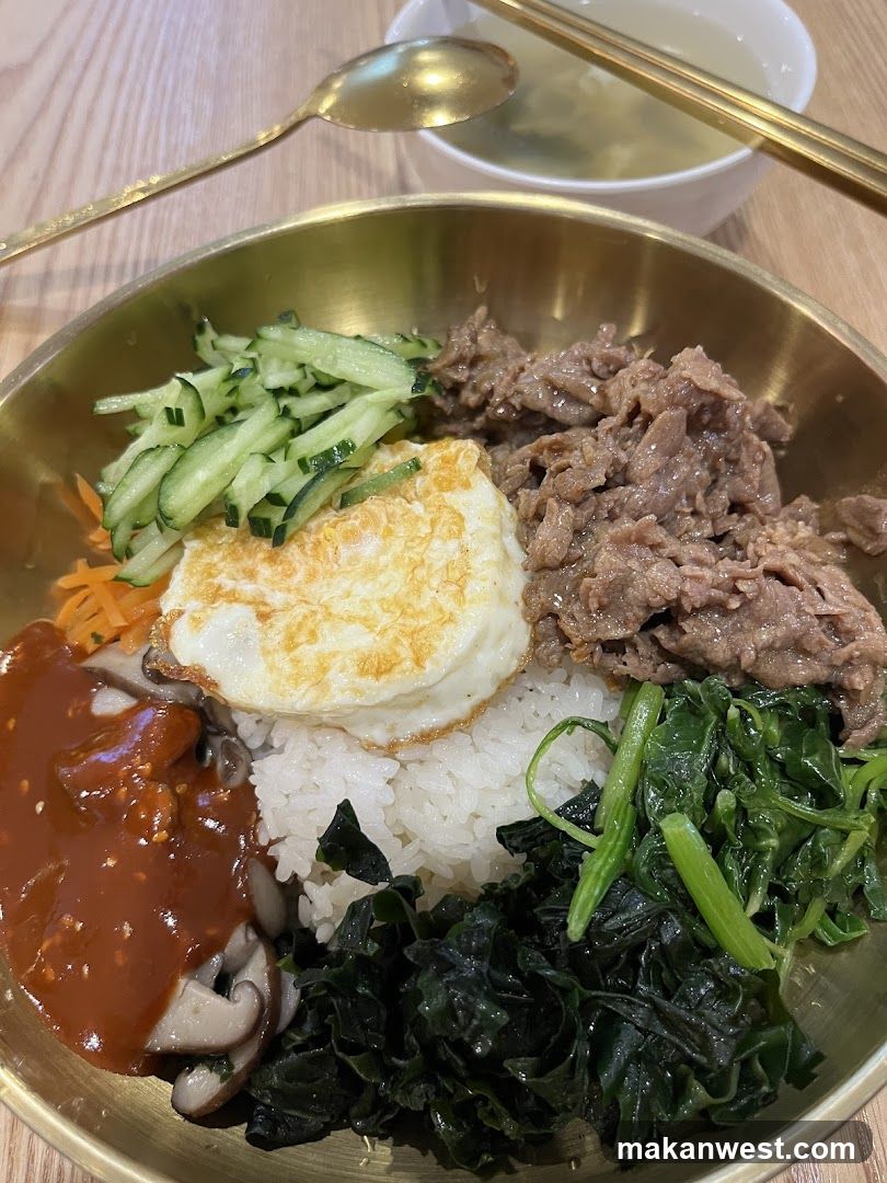 Bowl of Korean-style Bibimbap with Fried Egg and Beef