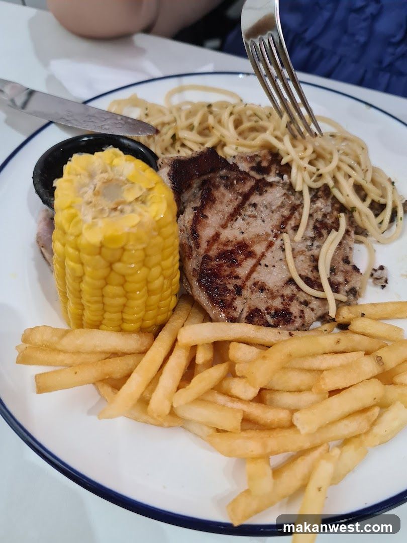 Plate of Food with Steak, Pasta, Fries and Corn