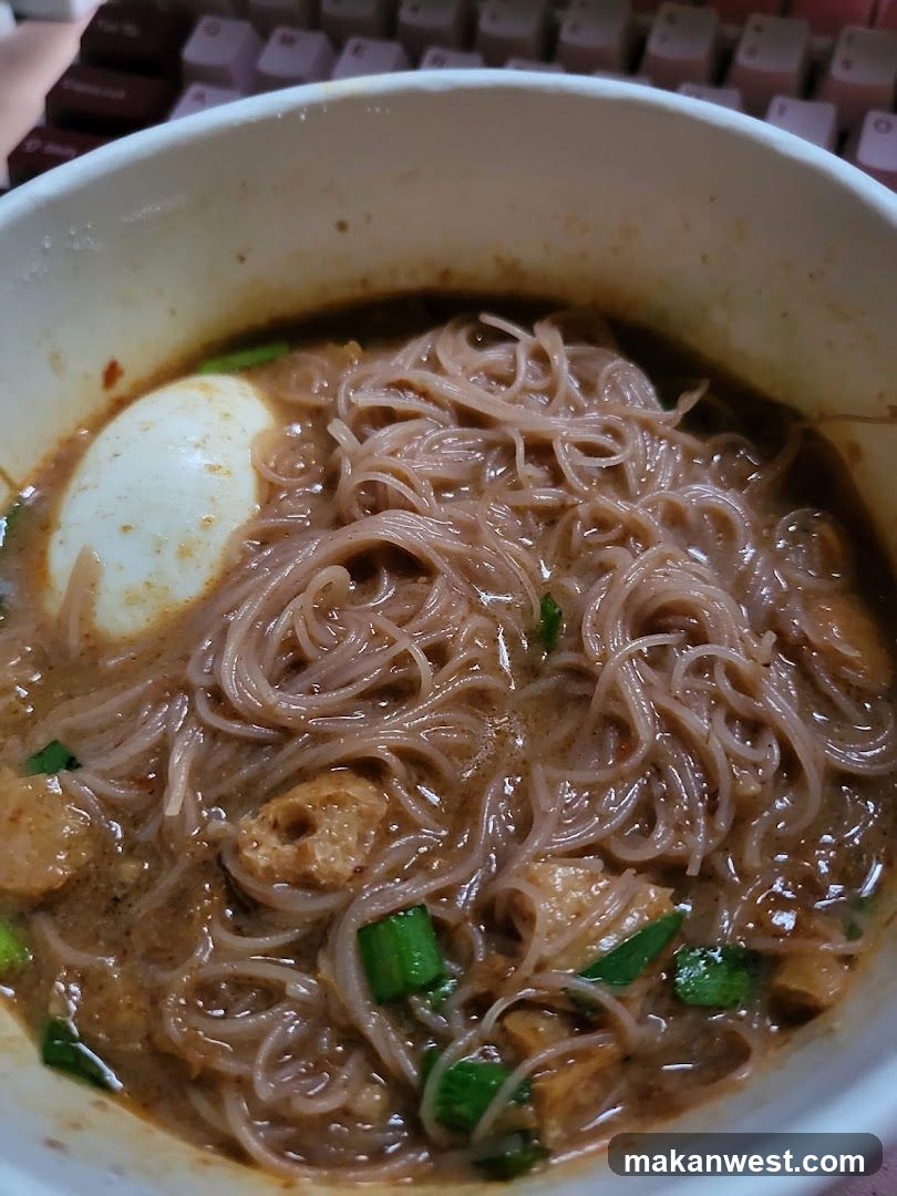 Bowl of Noodles with Egg and Green Onions