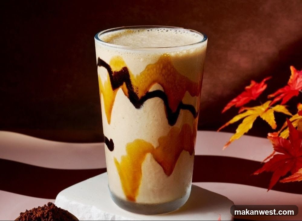 Autumn-themed beverage with maple syrup and chocolate drizzle