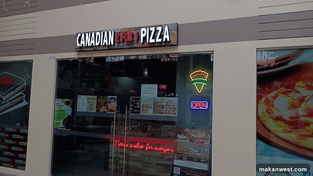 A storefront with a sign reading 'CANADIAN 2 FOR 1 PIZZA'. The entrance features glass doors and windows displaying various posters, including one advertising pizza slices. A neon sign of a pizza slice is visible on the right side of the window, along with an illuminated 'OPEN' sign. Inside, there are additional promotional materials and menus displayed.