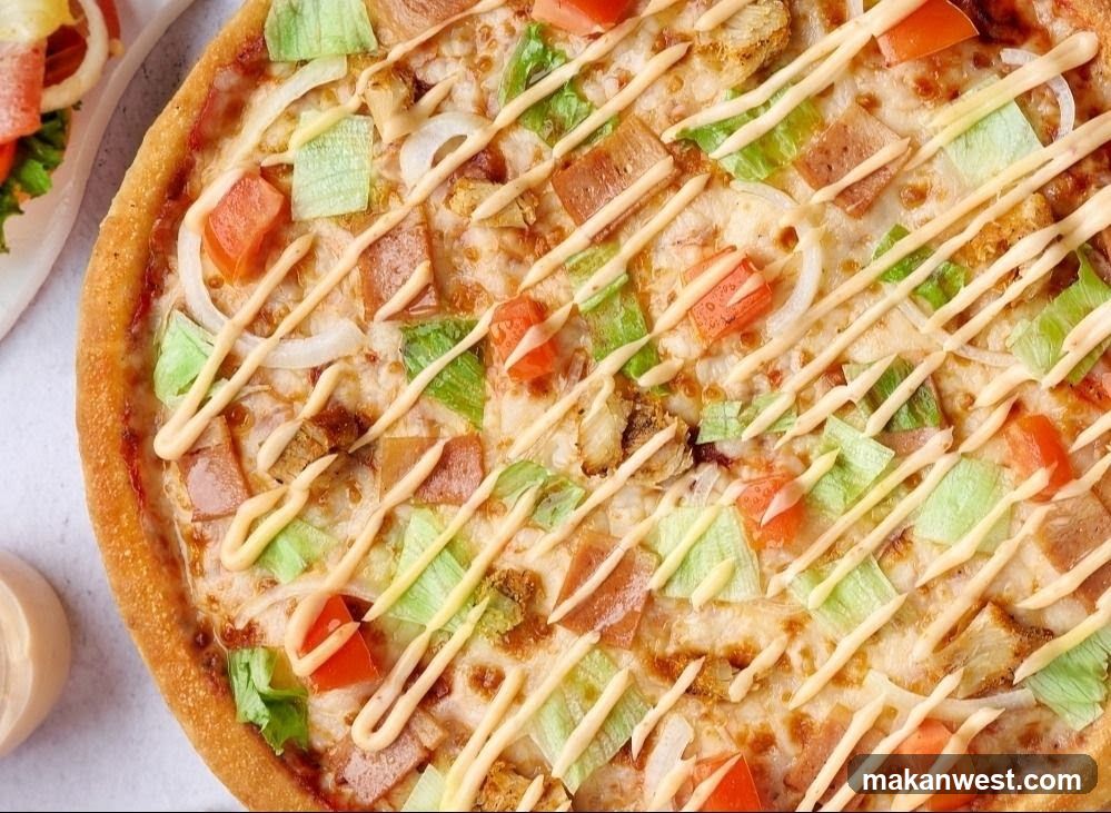 Pizza with toppings and sauce drizzle