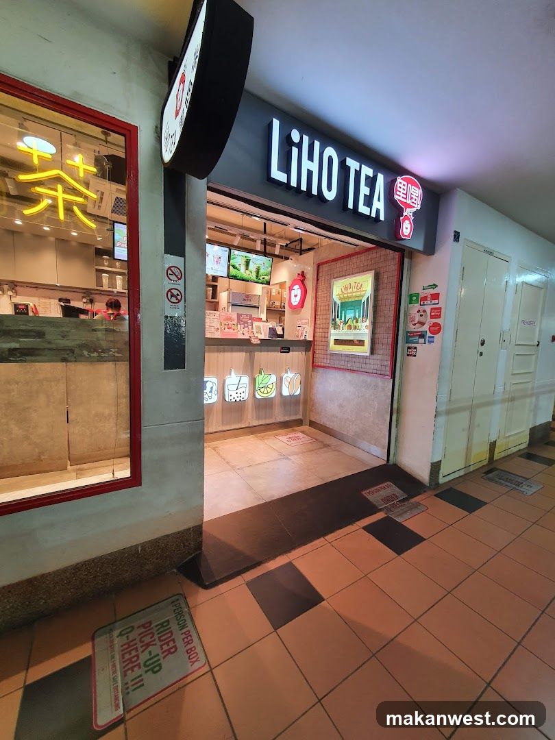 A Liho Tea shop entrance with illuminated signage and a visible interior counter area.