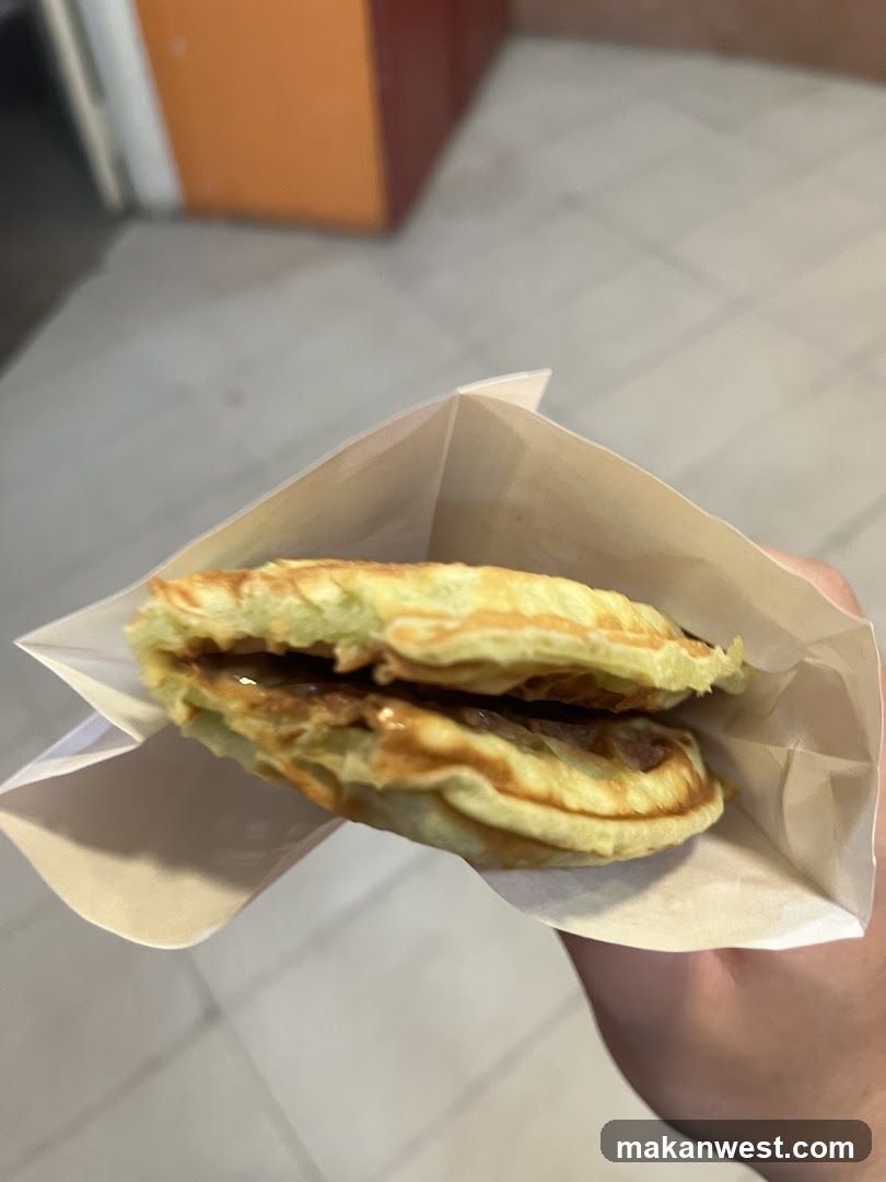 Handheld Food Item in Paper Wrapper