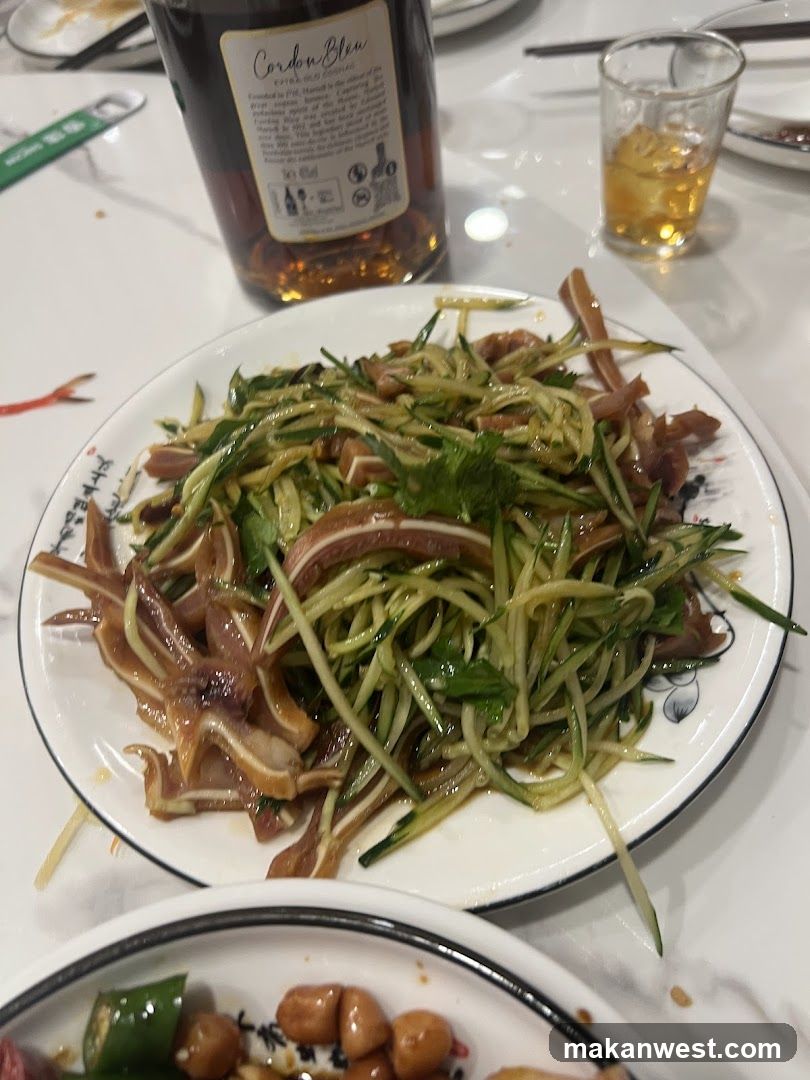 Dish with Cucumber and Meat on Table