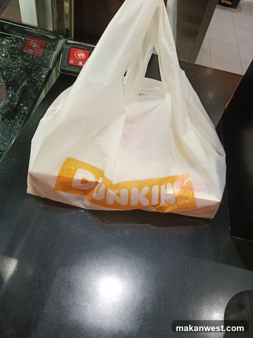 Dunkin Donuts bag on counter