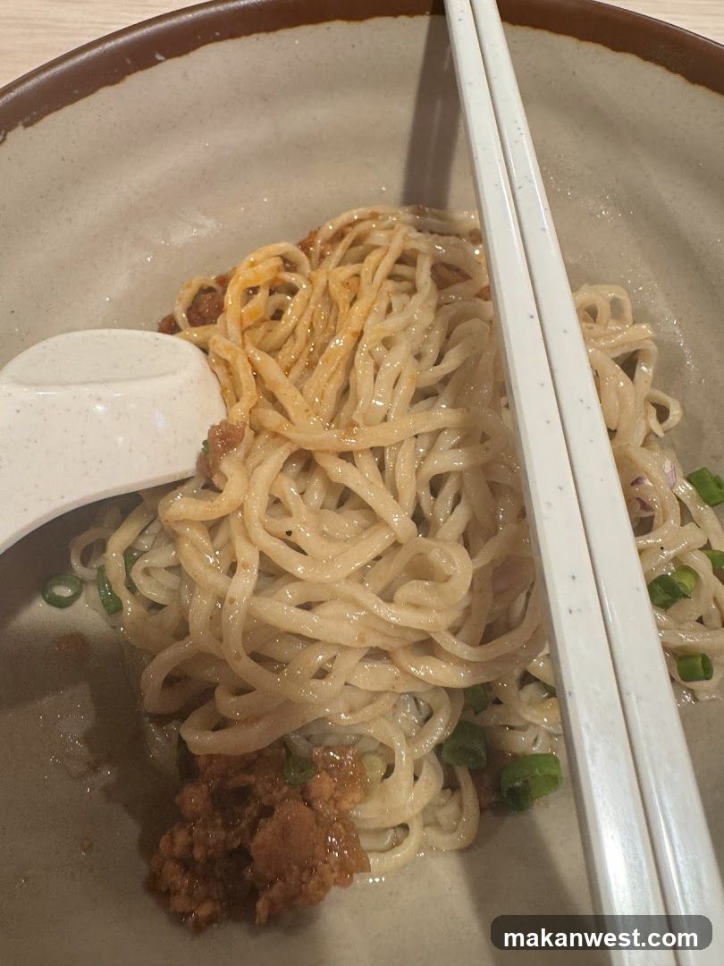 Noodle Bowl with Chopsticks and Spoon
