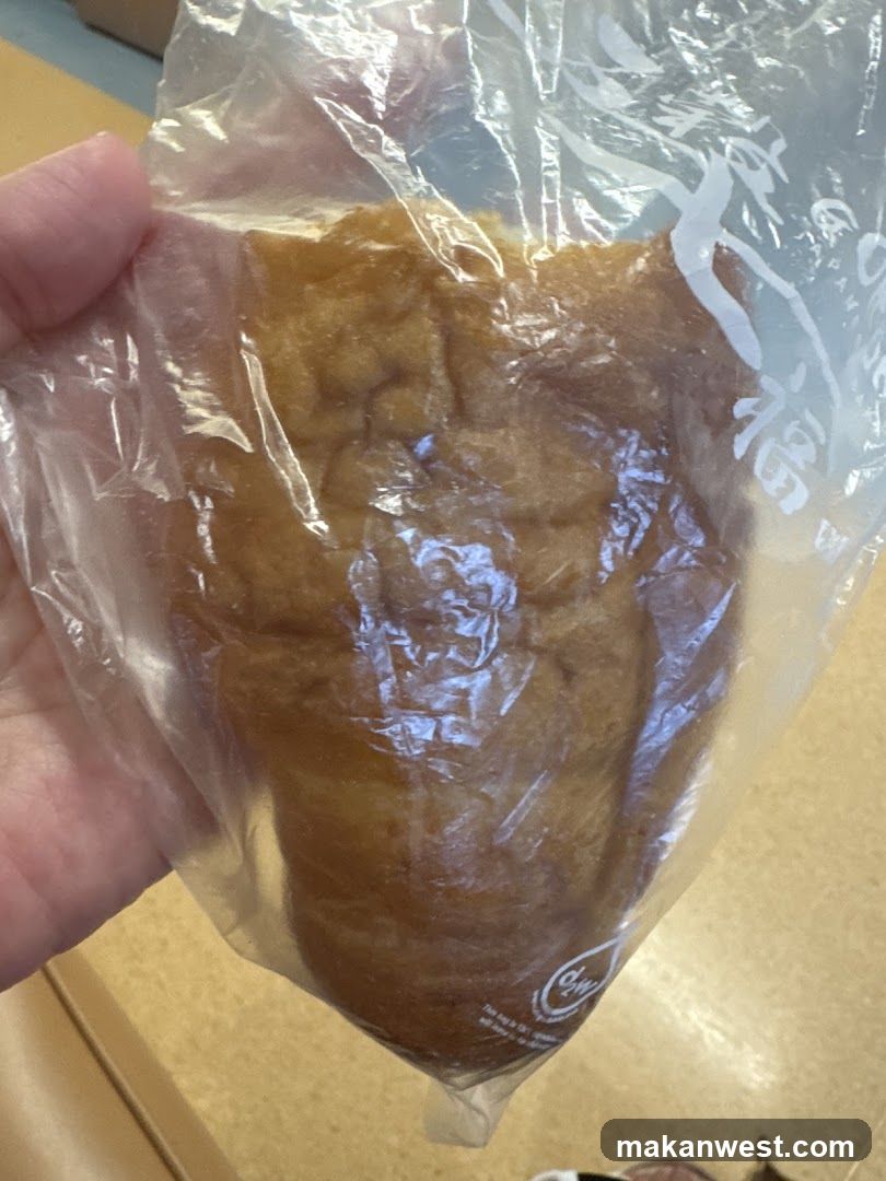 Hand holding a packaged pastry
