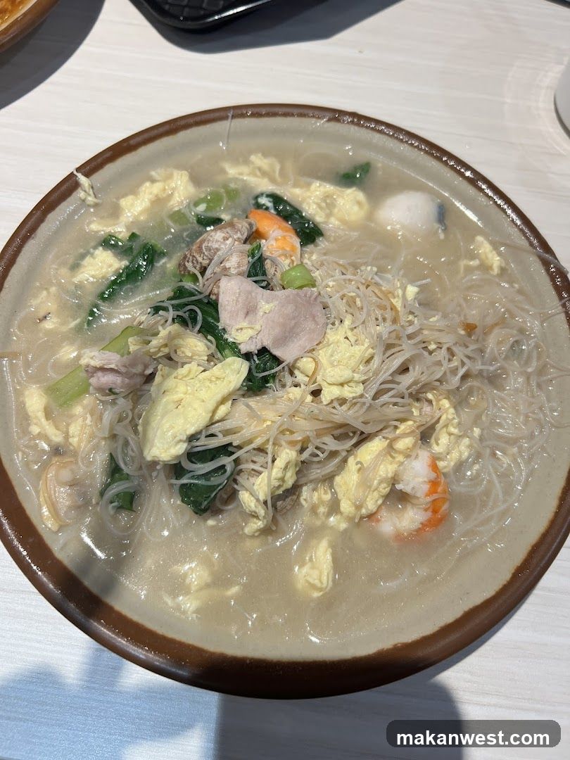 Bowl of Noodle Soup with Vegetables and Meat