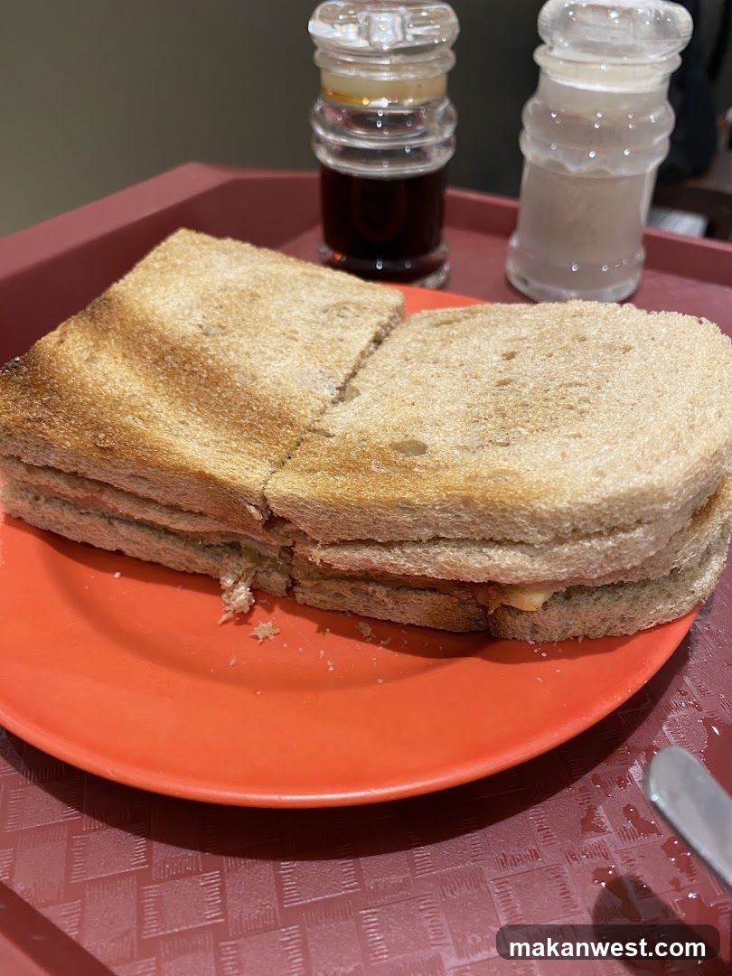 Toasted Sandwich on Orange Plate