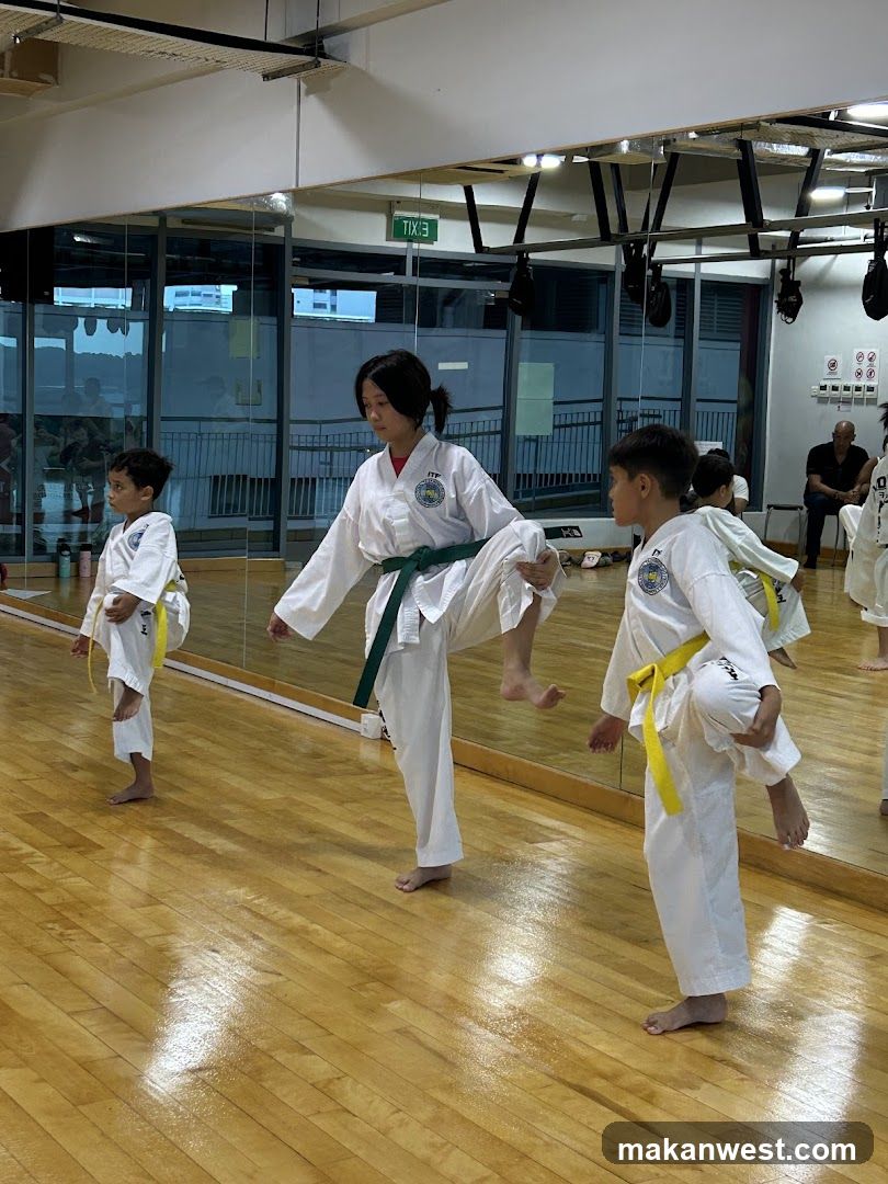 Kids practicing martial arts in a dojo