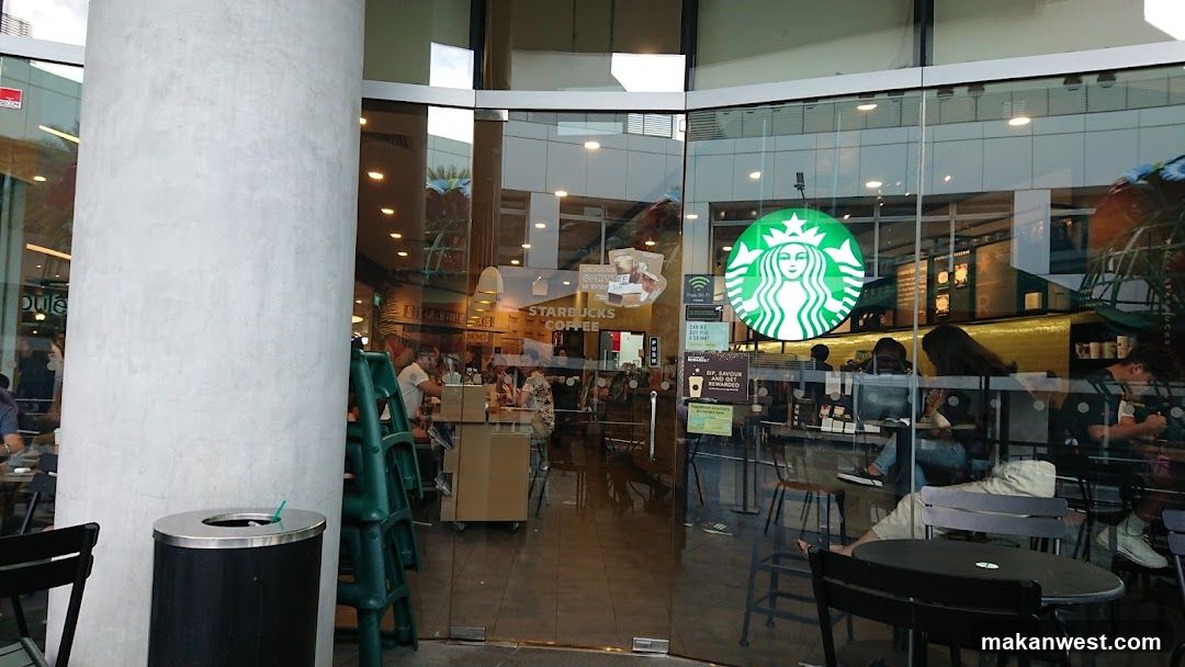 Photo of a Starbucks storefront with visible signage and glass entrance.