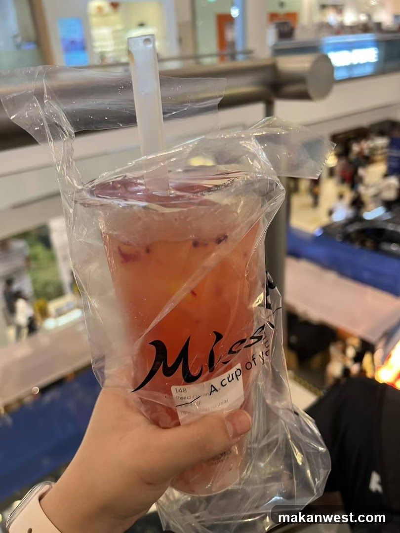 Handheld Pink Drink in Plastic Bag