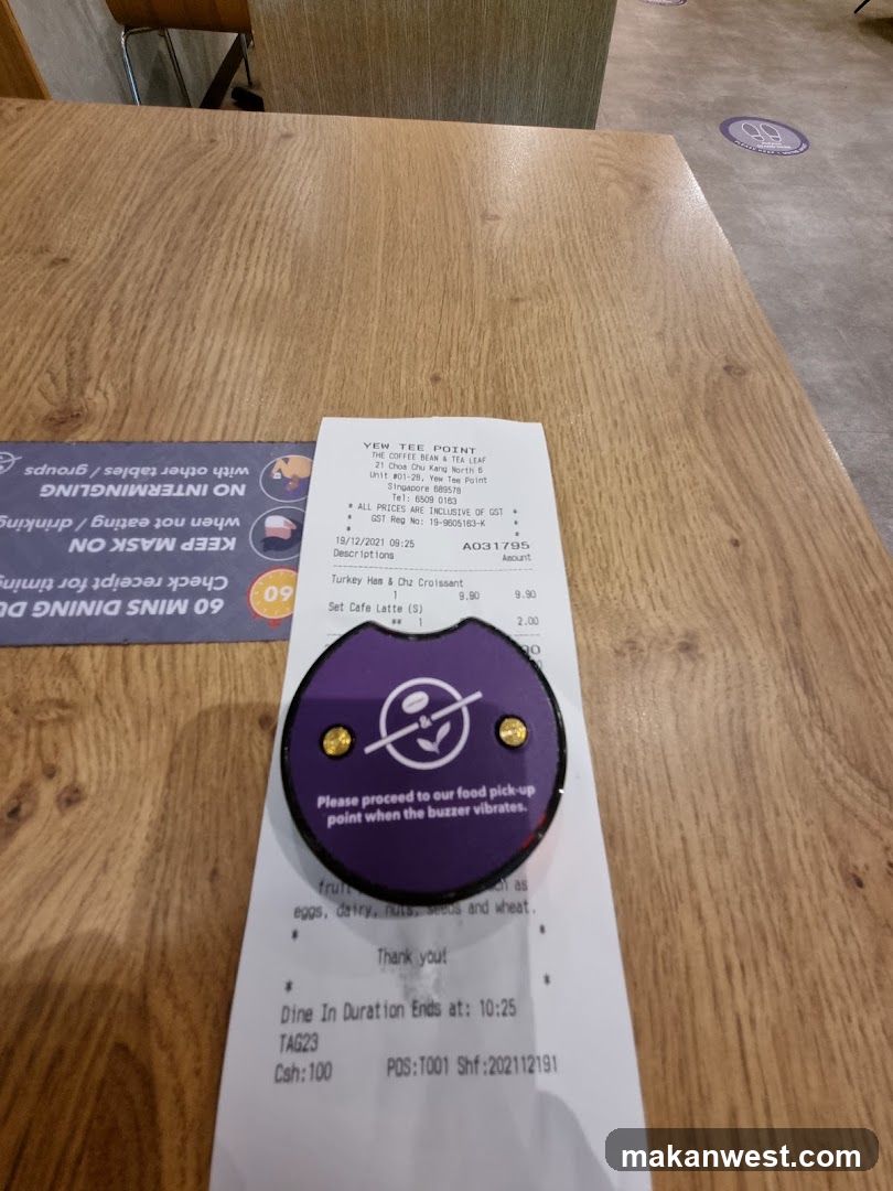 Receipt on Table with Buzzer