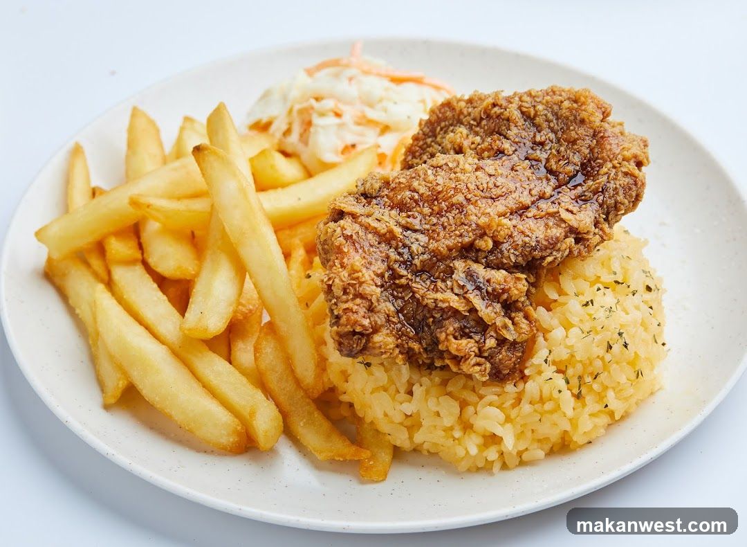 Fried Chicken Rice Plate with Fries and Coleslaw