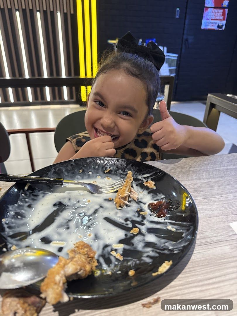 Child Enjoying Meal at Restaurant