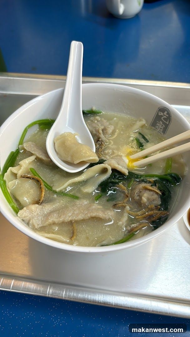 Bowl of Soup with Dumplings and Greens