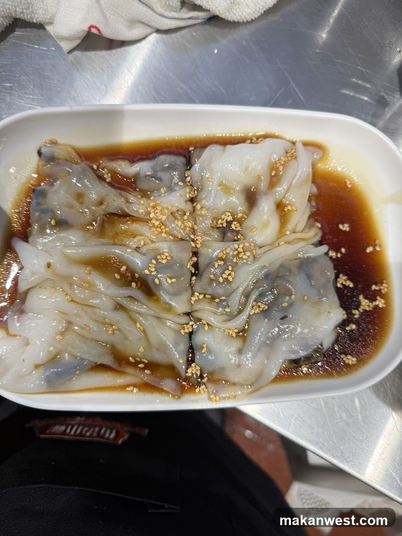 Steamed Rice Rolls with Sauce and Sesame Seeds