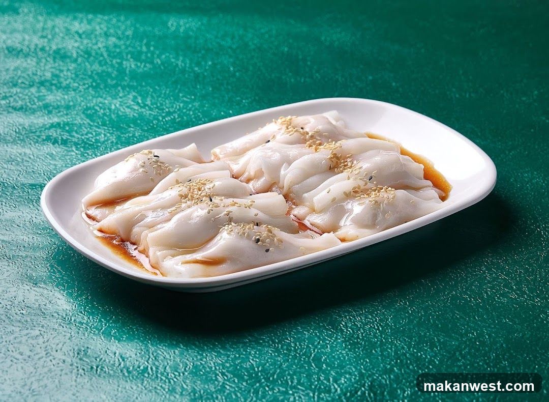Dish of translucent dumplings with sauce and sesame seeds