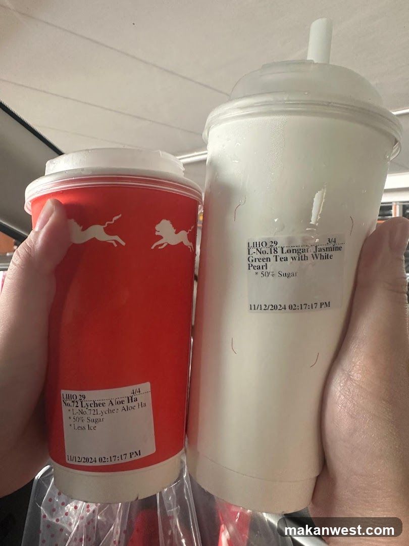Two iced tea drinks held in hand