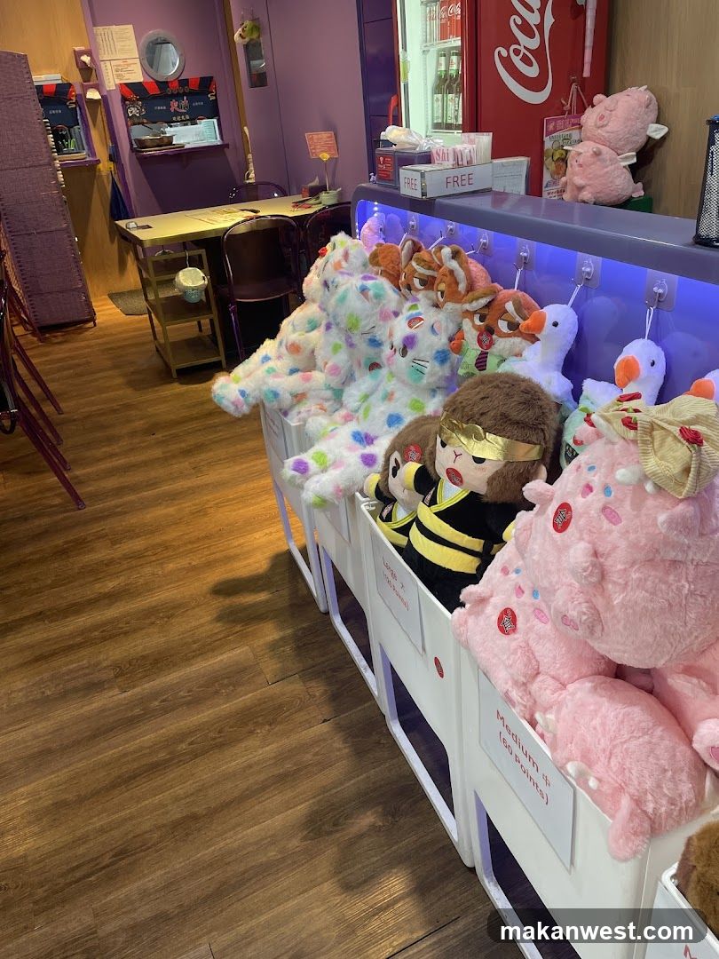 Claw Machine Interior with Plush Toys and Dining Area