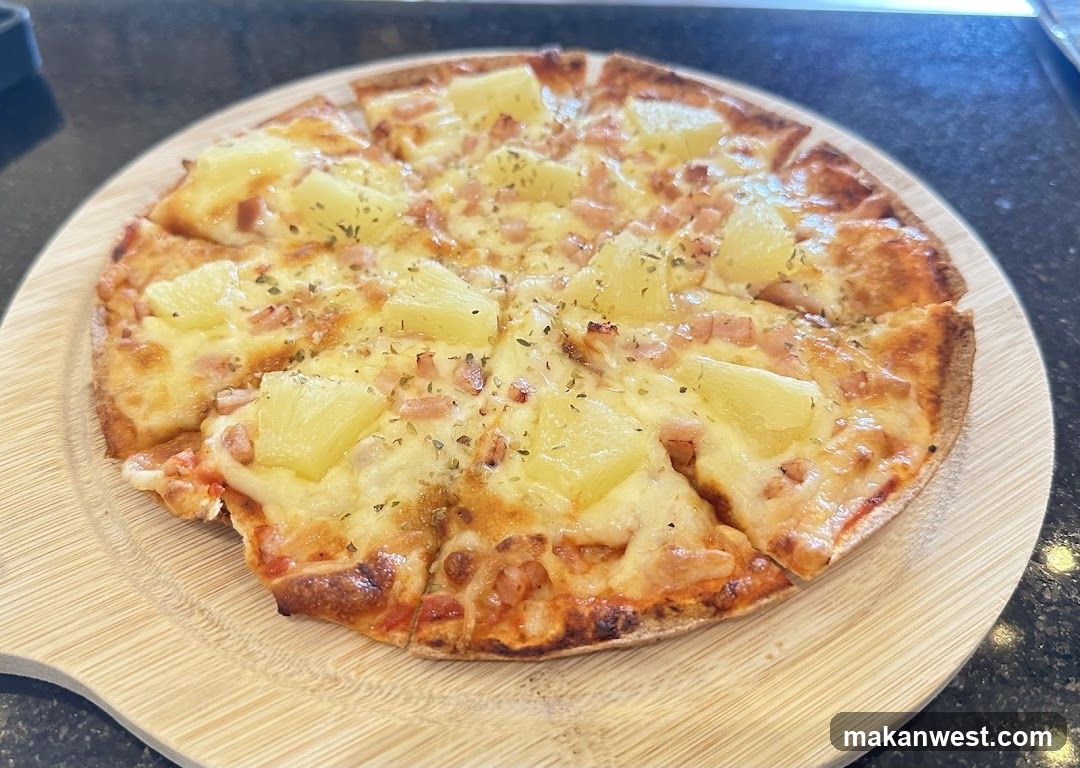 Pineapple and Ham Pizza on Wooden Board