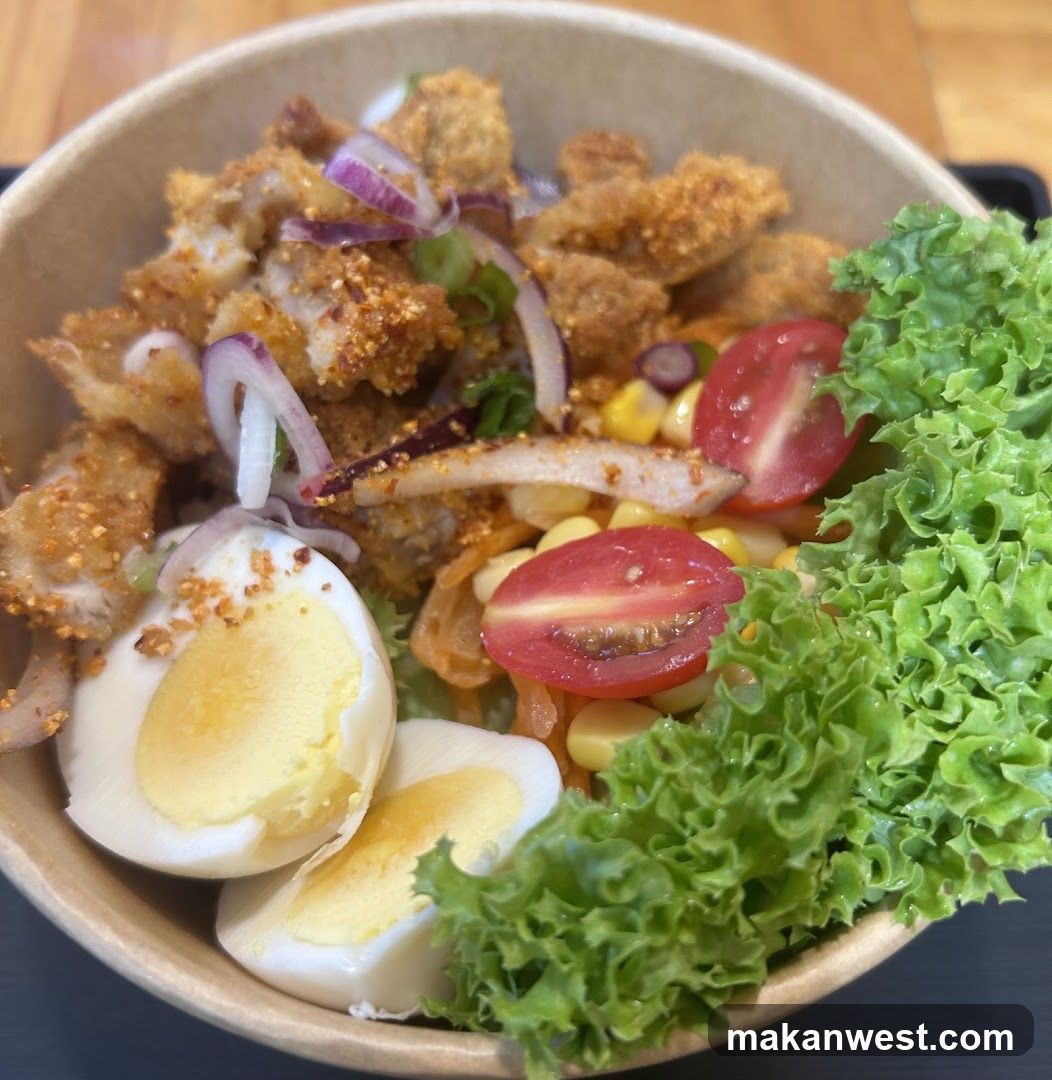 Bowl of Fried Chicken Salad with Egg and Lettuce