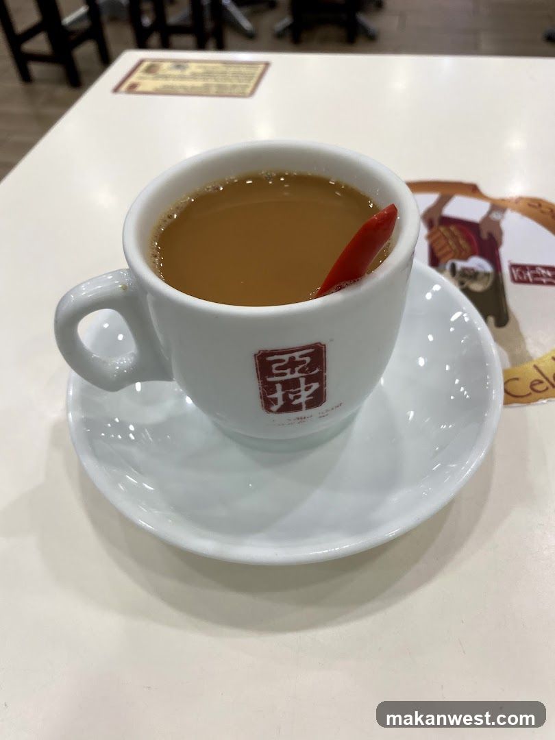Cup of coffee with stir stick