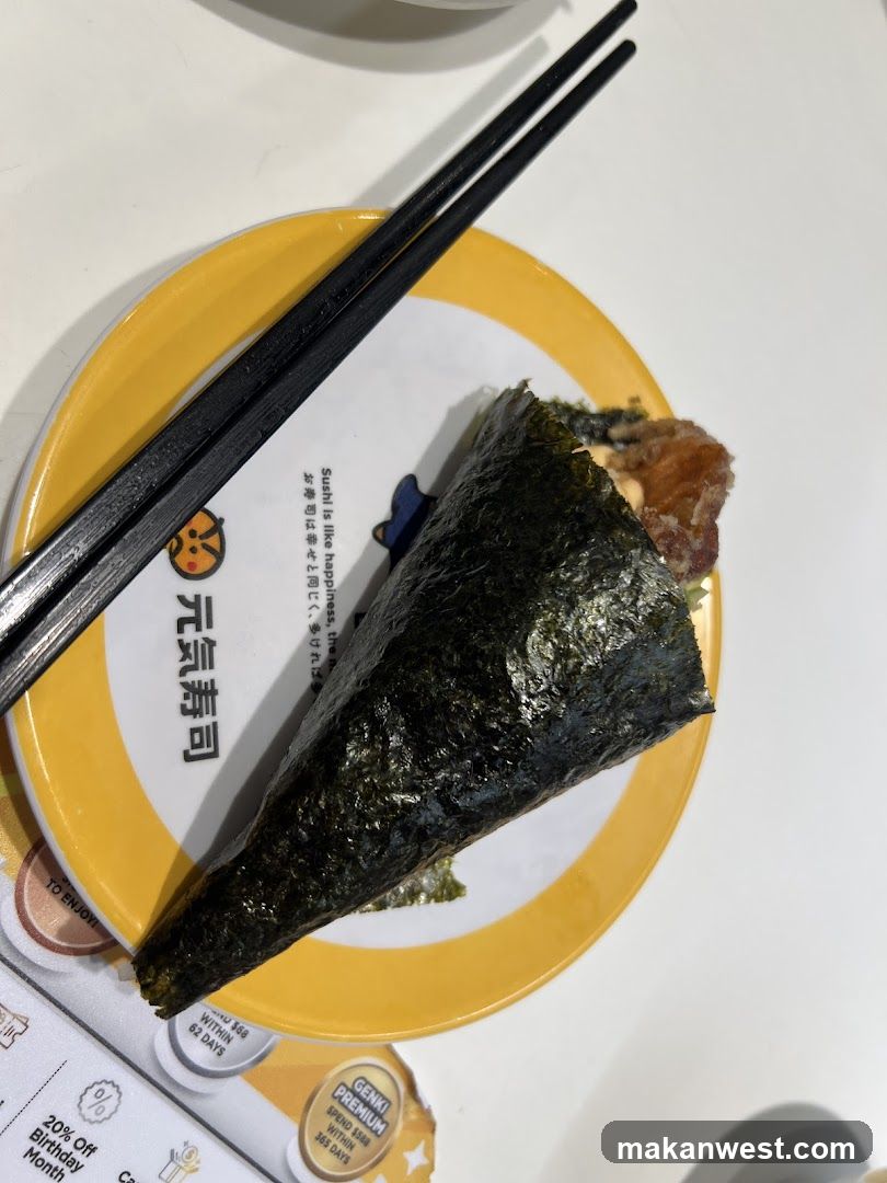 Onigiri on a yellow plate with chopsticks