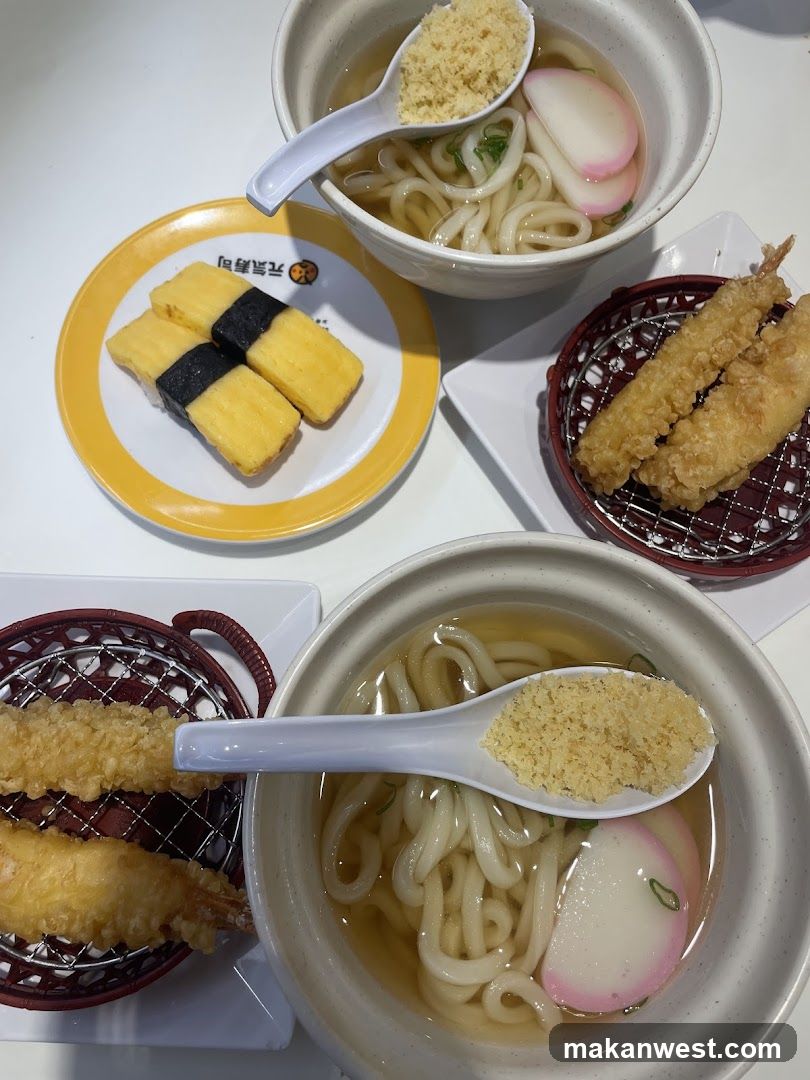 Udon Noodle Meal with Tempura and Sushi