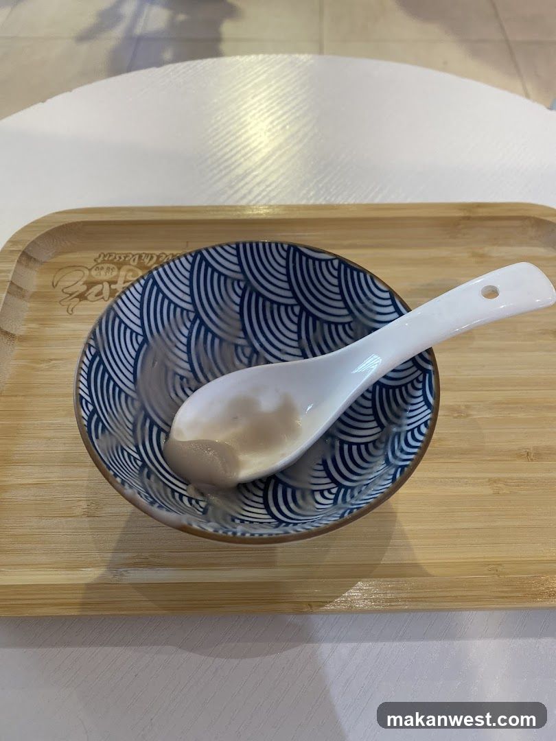 Bowl with Spoon on Wooden Tray