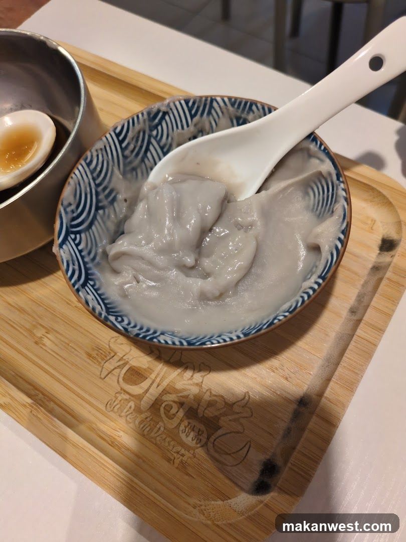 Bowl of Grey Porridge with Soy Sauce