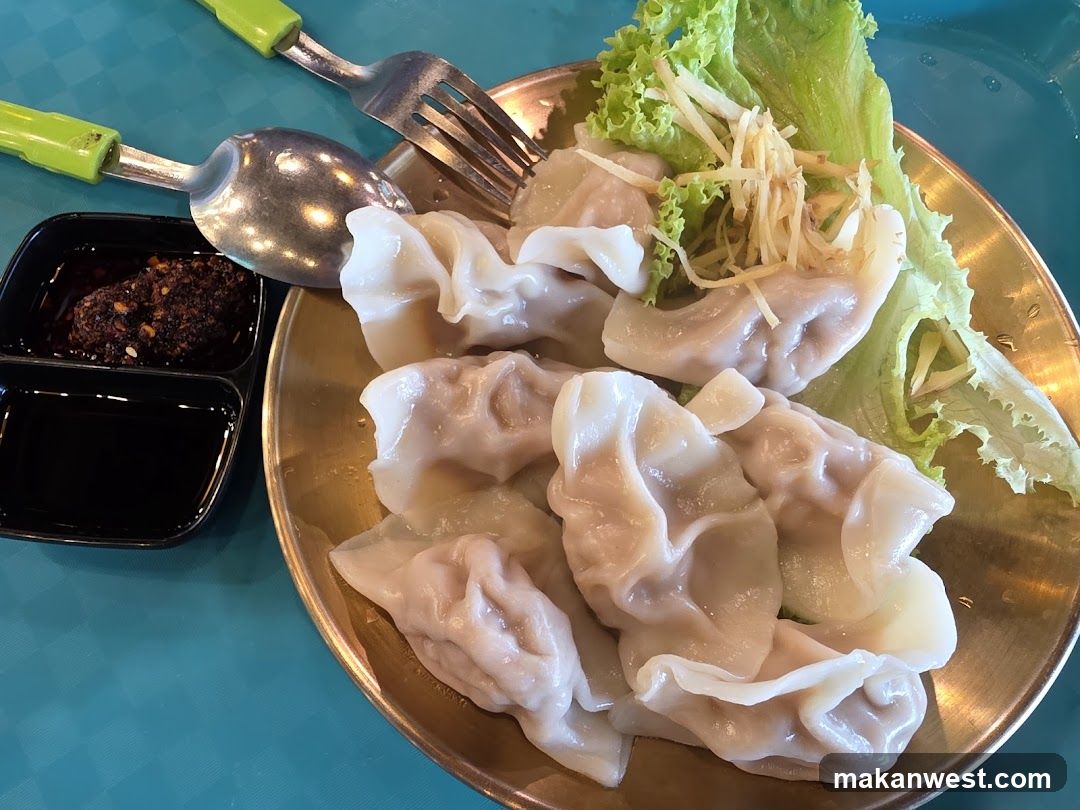 Dumplings with garnish and dipping sauces