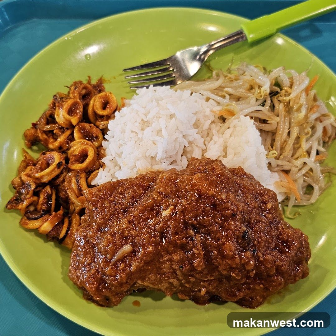 Plate of Curry Chicken with Rice and Side Dishes