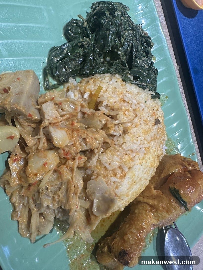 Plate of Chicken Rice with Side Dishes
